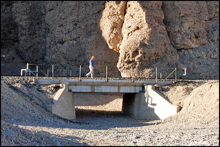 A railroad bridge marks the entrance to a slot canyon