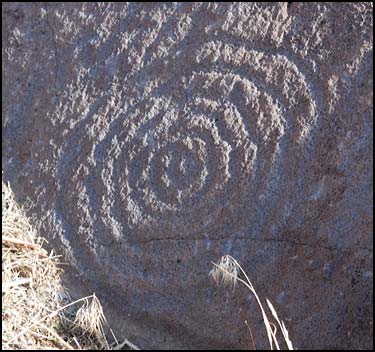 A spiral symbol covered with desert varnish