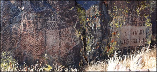 Solid forms on a large boulder